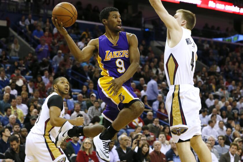 Lakers guard Ronnie Price, here against New Orleans guard Nate Wolters in January, will be sidelined six to eight weeks while recovering from elbow surgery.