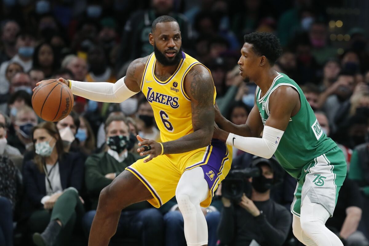 LeBron James controls the ball in front of Boston's Josh Richardson.