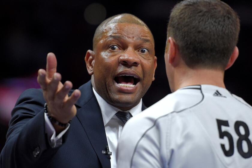 Clippers Coach Doc Rivers talks to official Josh Tiven during the second half of Game 5 on Tuesday night at Staples Center.