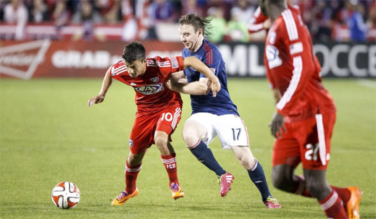 Chivas USA's Thomas McNamara, right, and FC Dallas' Mauro Diaz, left, battle for control of the ball during a match on March 22.