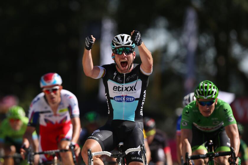 Mark Cavendish of Great Britain celebrates his stege seven victory of the Tour de France on Friday.