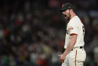 San Francisco Giants starting pitcher Carlos Rodón reacts after striking out Arizona Diamondbacks' Jordan Luplow with the bases loaded during the sixth inning of a baseball game in San Francisco, Wednesday, Aug. 17, 2022. Rodón had three strikeouts in the inning. (AP Photo/Godofredo A. Vásquez)