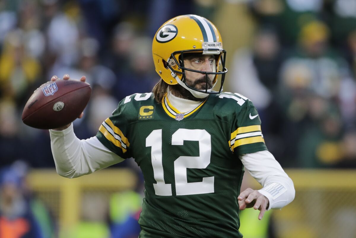 Green Bay Packers' Aaron Rodgers throws during the first half of an NFL football game against the Los Angeles Rams Sunday, Nov. 28, 2021, in Green Bay, Wis. (AP Photo/Aaron Gash)