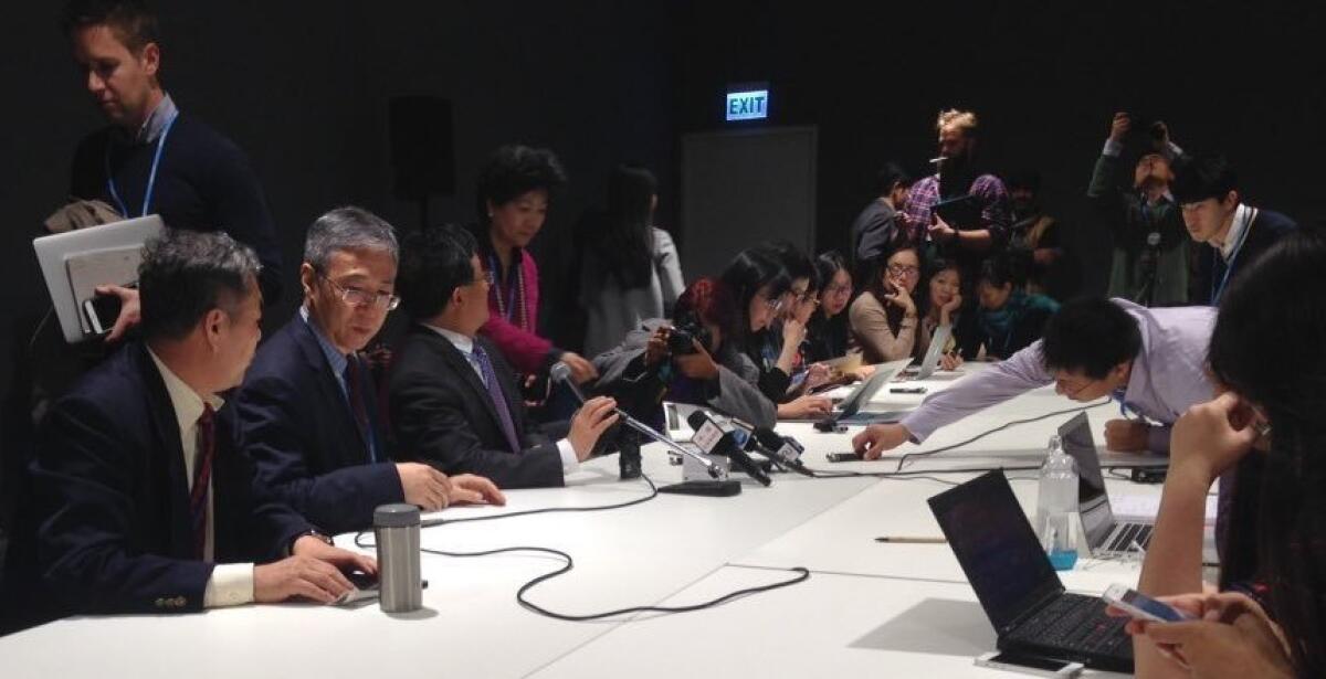 The Chinese delegation gives a briefing at the COP 21 climate change conference outside Paris.