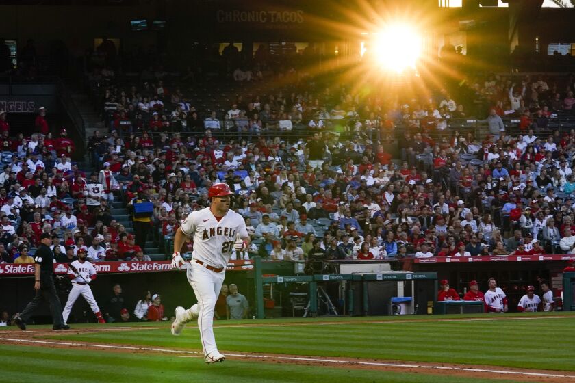 Los Angeles Angels' Mike Trout (27) runs the bases after hitting a home run during the fourth inning of a baseball game against the Chicago Cubs in Anaheim, Calif., Wednesday, June 7, 2023. (AP Photo/Ashley Landis)