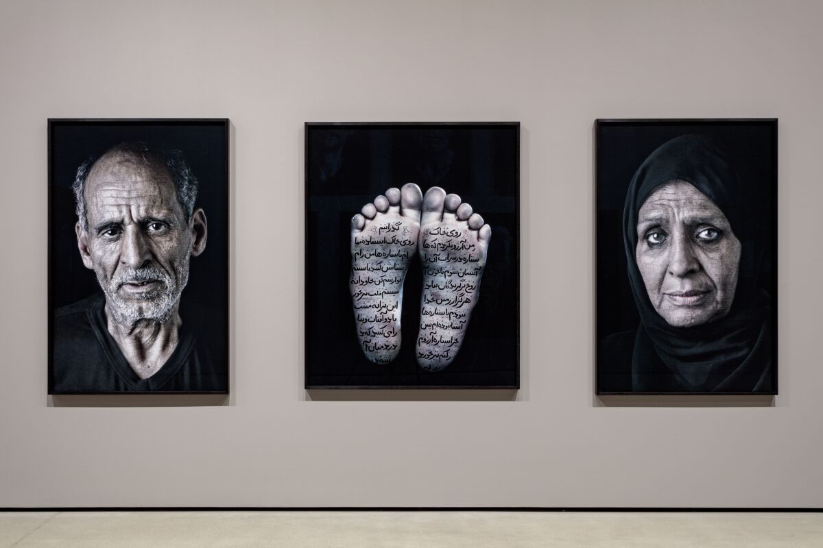 Large-format photographs alternate with films and videos in Shirin Neshat's retrospective exhibition.