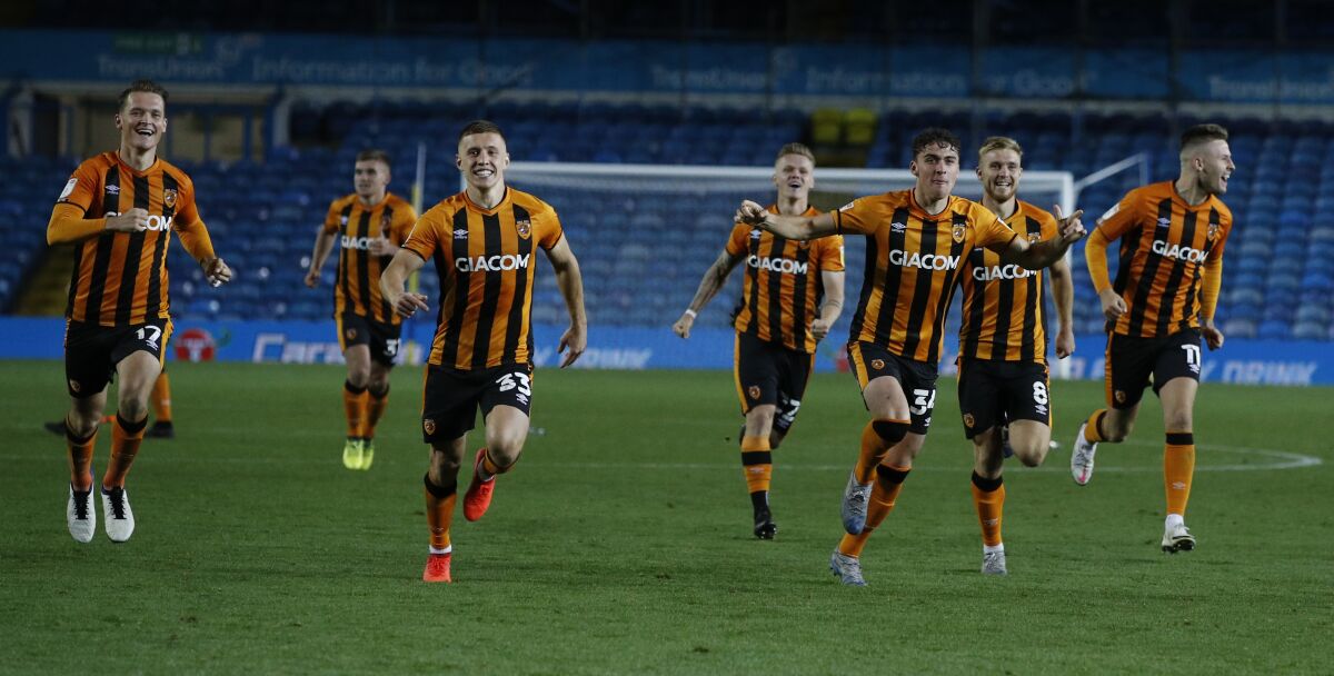 Hull's players run to celebrate after their winning penalty following the penalty shootout, during the English League Cup soccer match between Leeds United and Hull in Leeds, England, Wednesday, Sept. 16, 2020. (Phil Noble/Pool via AP)