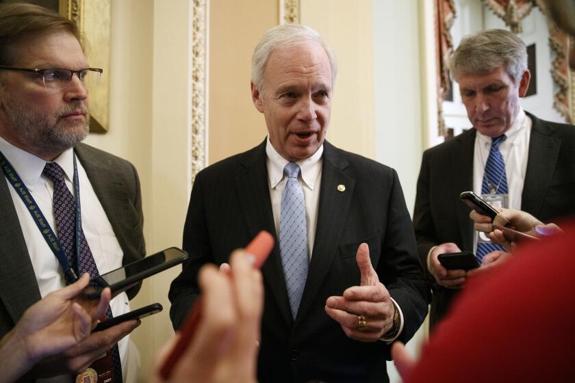 Sen. Ron Johnson, R-Wis., speaks to reporters, Monday, Jan. 27, 2020, on Capitol Hill in Washington, about the impeachment trial of President Donald Trump on charges of abuse of power and obstruction of Congress. (AP Photo/ Jacquelyn Martin)