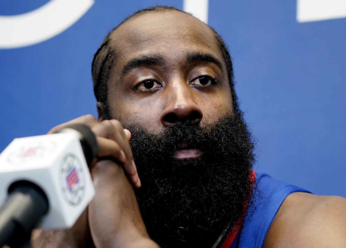 James Harden listens to a reporter's question after being introduced as the newest member of the Clippers on Thursday.