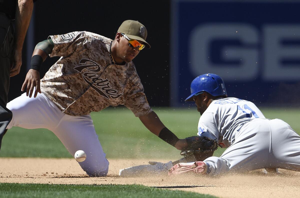 Dodgers shortstop Jimmy Rollins steals second base as Padres third baseman Yangervis Solarte loses the ball during the fifth inning.