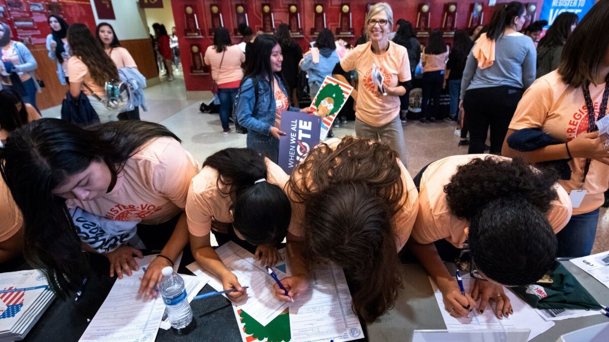 High school students preregister to vote at the Girls Build summit last month at USC.