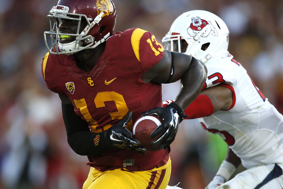 Bryce Dixon hauls in a touchdown pass against Fresno State last season.