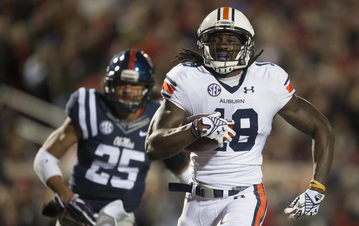 Auburn wide receiver Sammie Coates outruns Mississippi defensive back Cody Prewitt to score on a 57-yard pass from quarterback Nick Marshall in Oxford, Miss., on Saturday.