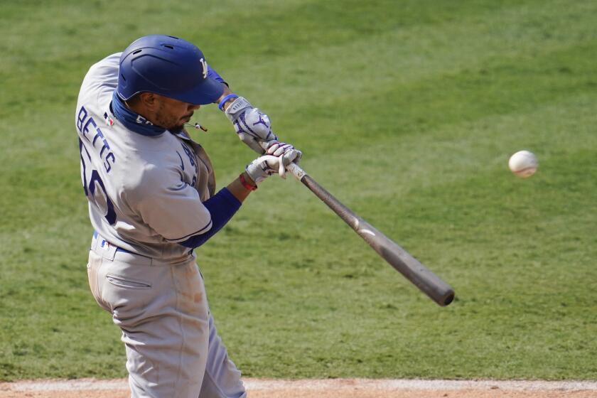 Los Angeles Dodgers' Mookie Betts hits during a baseball game against the Los Angeles Angels.