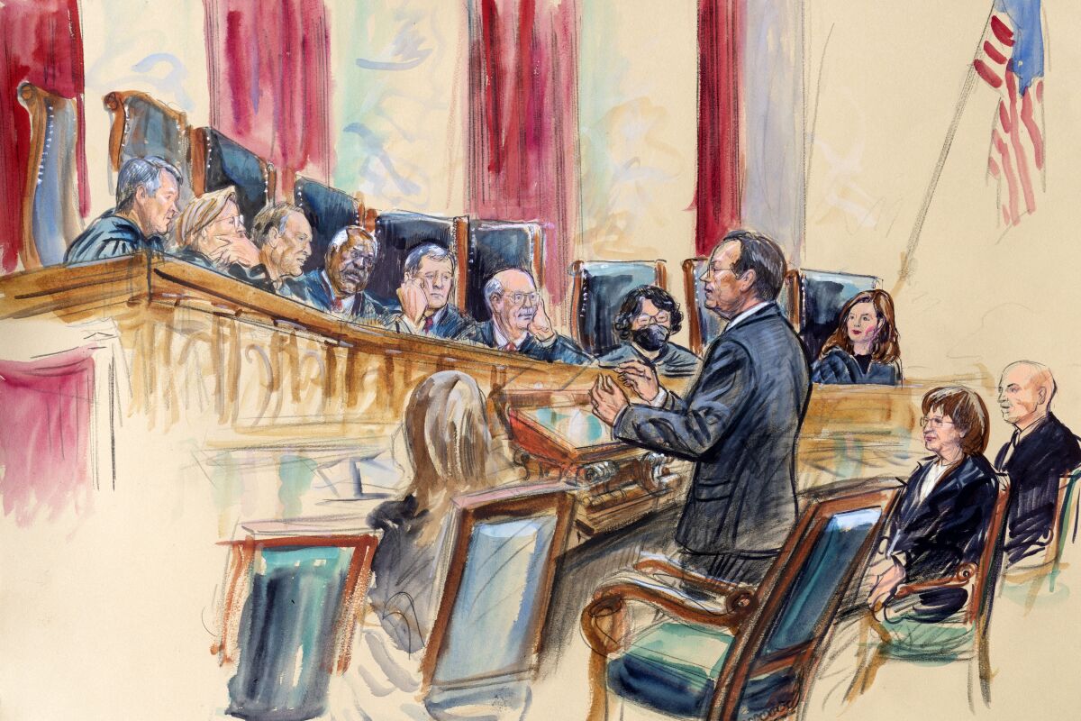 This artist sketch depicts Paul Clement standing while speaking to the Supreme Court, Wednesday, Nov. 3, 2021, in Washington. Seated right of Clement is Barbara Underwood, Solicitor General New York and Brian Fletcher, Principal Deputy Solicitor General, Department of Justice Washington. Justices seated from left are Associate Justice Brett Kavanaugh, Associate Justice Elena Kagan, Associate Justice Samuel Alito, Associate Justice Clarence Thomas, Chief Justice John Roberts, Associate Justice Stephen Breyer, Associate Justice Sonia Sotomayor, and Associate Justice Amy Coney Barrett. Associated Justice Neil Gorsuch was not present in the room and attended via video conference. (Dana Verkouteren via AP)