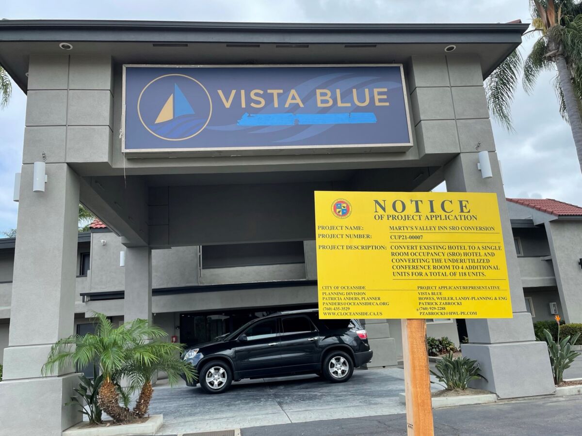 A sign outside Vista Blue says it's being converted into an SRO.