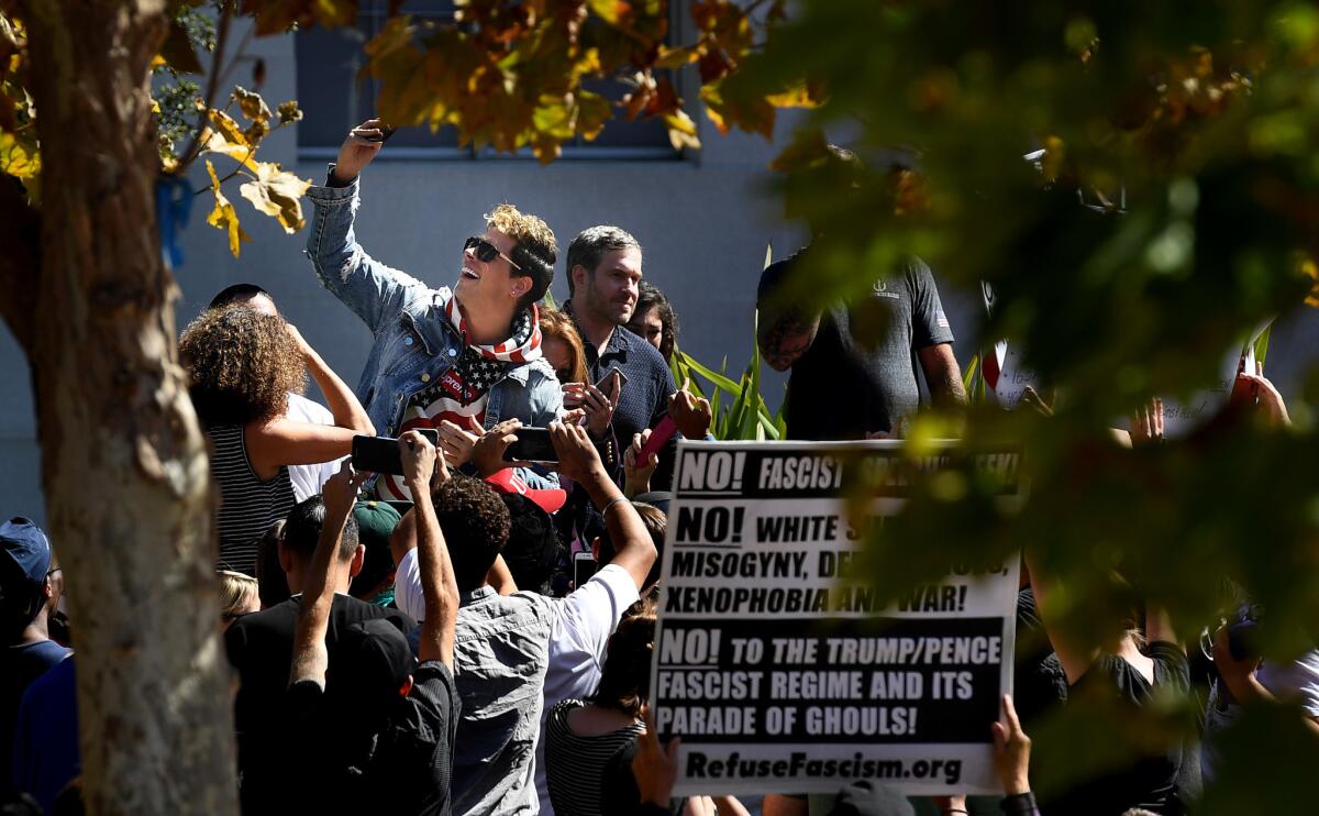 Milo Yiannopoulos takes a selfie with his supporters on Sunday in Sproul Plaza on the UC Berkeley campus after his speech. (Wally Skalij / Los Angeles Times)