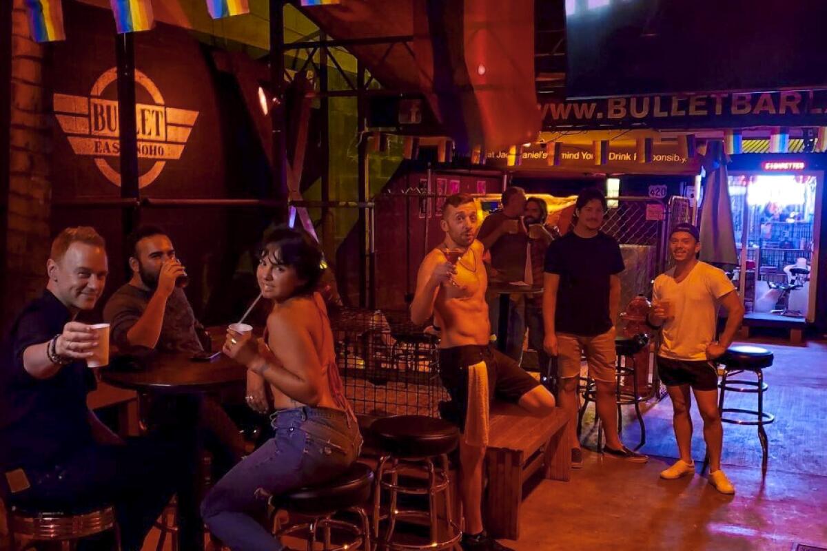Customers spend the night outside on the Bullet Bar's patio.