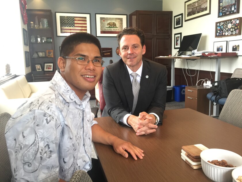 Raymond “Jay” Bariuan, left, has worked with San Diego County Supervisor Nathan Fletcher, right, since Fletcher was elected to the state Assembly in 2008. Bariuan has autism, and Fletcher has proposed a plan calling for all county departments to hire people with developmental disabilities.