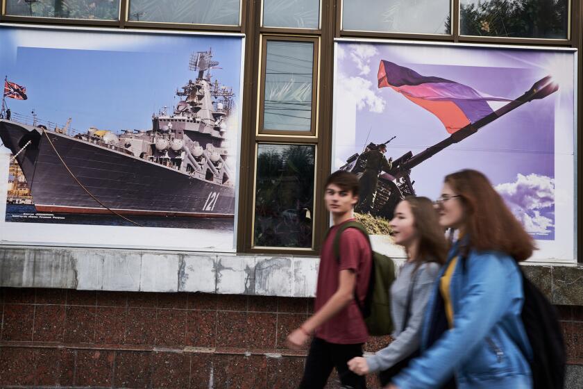 Students are seen passsing the Officer's club in Sevastopol. Oct. 30th, 2018.