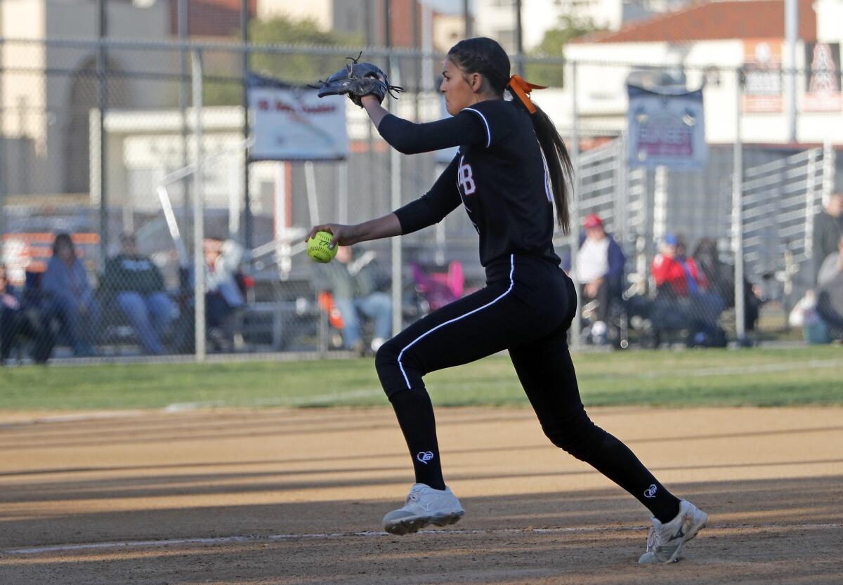 Huntington Beach High pitcher Grace Uribe, seen pitching against Los Alamitos on April 17, 2018, threw a two-hitter in the Oilers' 7-0 win over the Griffins on Tuesday.