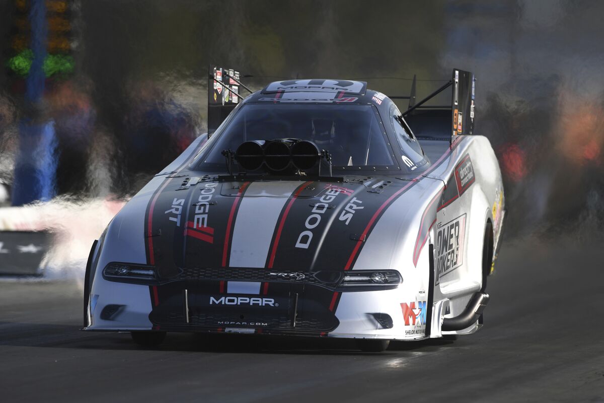 In this photo provided by the NHRA, Matt Hagan drives in Funny Car qualifying Saturday, June 4, 2022, for the NHRA New England Nationals drag races at New England Dragway in Epping, N.H. (Marc Gewertz/NHRA via AP)
