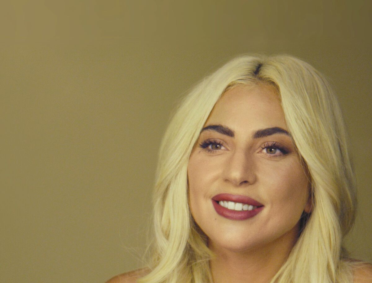 A woman with blond hair smiling