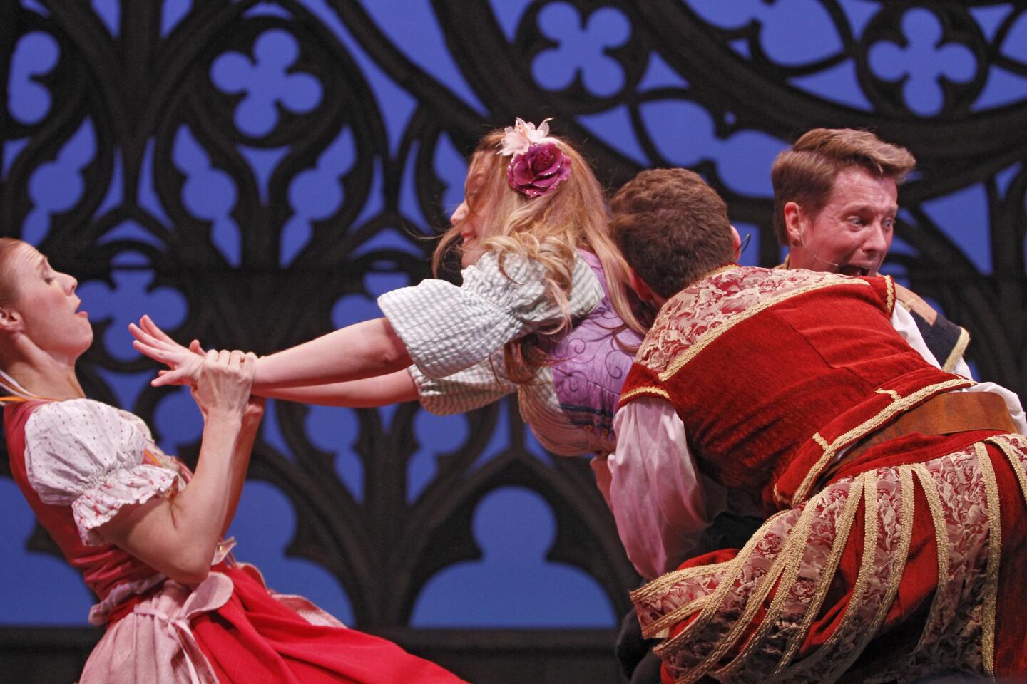 Theatrical Education Group's Shakespearience actors, left, to right, Alyson King as Helena, Lindsey Scott as Hermia, Bryce Lourie as Demetrius and Justin Eick as Lysander perform A Midsummer Night's Dream for a full house of students at the Alex Theater in Glendale on Tuesday, Jan. 20, 2015.