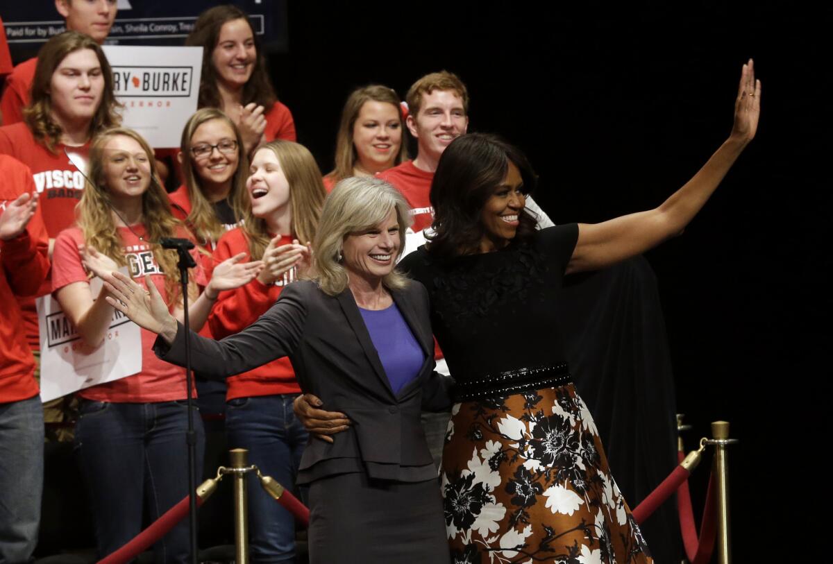 First Lady Michelle Obama with Wisconsin Democratic gubernatorial candidate Mary Burke at a campaign event for Burke in Madison, Wis.