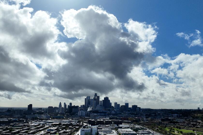 LOS ANGELES, CA FEBRUARY 19, 2026 -- Skies begin to clear with a view of downtown Los Angeles after a heavy downpour as a third storm system brought more rain to an already saturated Southland Thursday, Feb. 19, 2026. (Allen J. Schaben / Los Angeles Times)