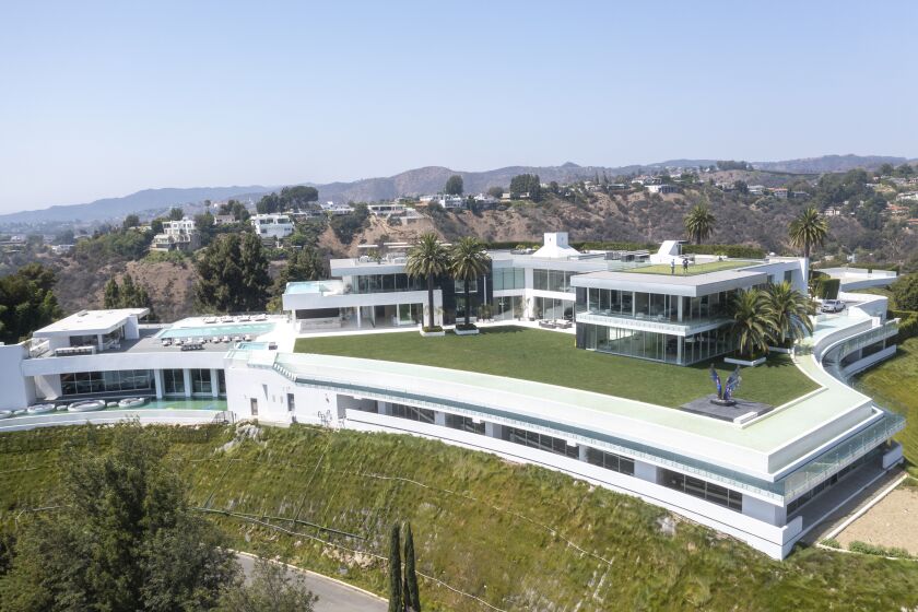 Beverly Hills, CA - September 08: An aerial view of "The One Bel Air", a 105,000-square-foot mansion with a sky deck and putting green, night club, several swimming pools, a 50-seat theater, a four-lane bowling alley and more by Nile Niami of Skyline Development and designed by Paul McClean (McClean Design). The One is shown by court-appointed receiver Ted Lanes, who now controls the property and is in charge of finding a buyer and paying off the lenders and other creditors, gives a tour of The One, the 105,000 square foot house on sale in Bel Air. This is apparently the largest home for sale in the United States. The developer Nial Niami "listed" it for $500 million but got into financial trouble and was foreclosed upon by Don Hankey. Photo taken in Bel Air on Wednesday, Sept. 8, 2021 in Beverly Hills, CA. (Allen J. Schaben / Los Angeles Times)