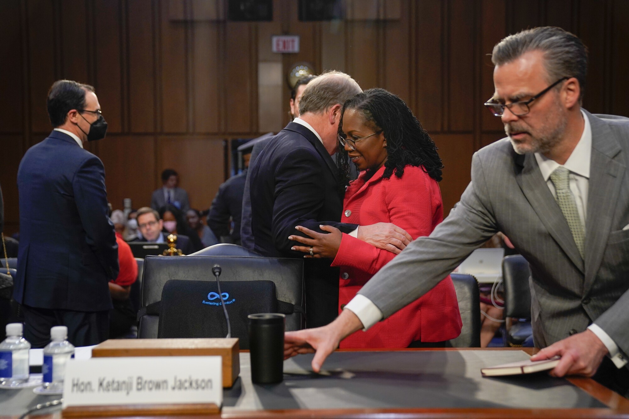 Supreme Court nominee Ketanji Brown Jackson talks with Doug Jones.