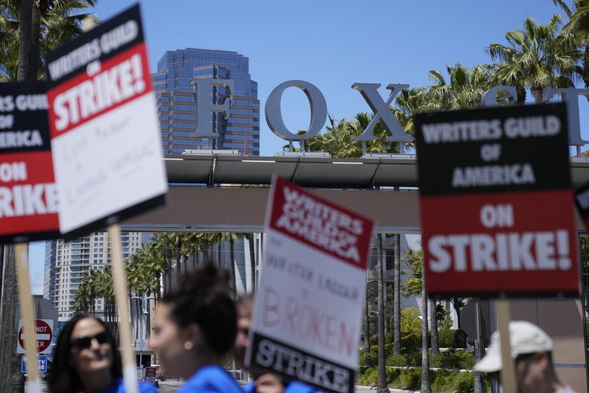 Members of the  Writers Guild of America picket outside Fox Studios in Los Angeles on May 2.