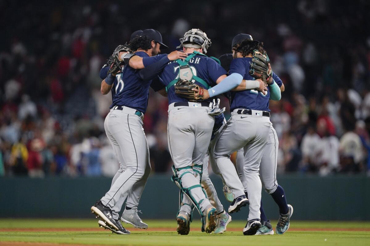 Ohtani pitches 7 innings, reaches base 5 times as Angels beat