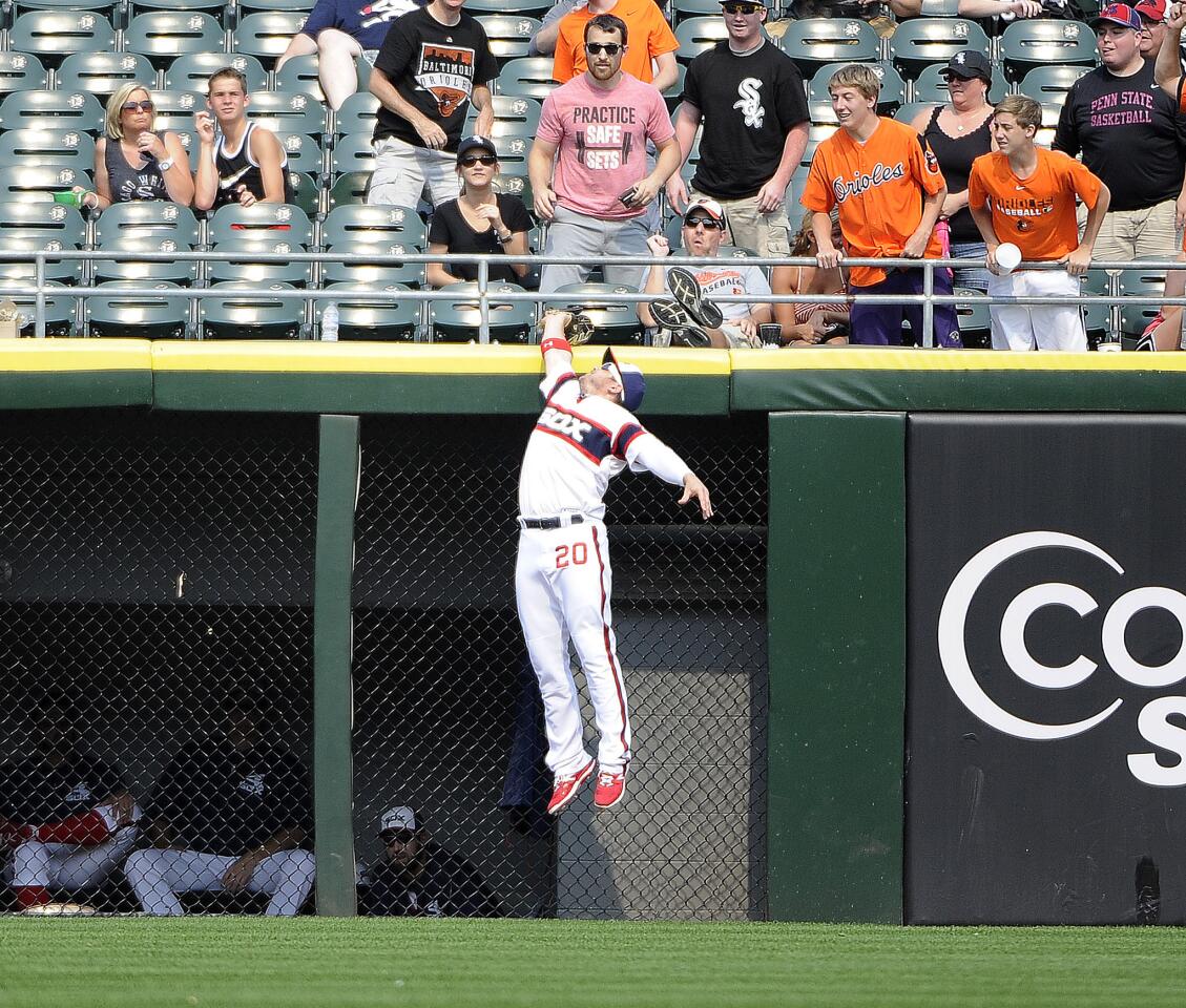 J.B. Shuck makes a leaping catch on Chris Davis during the eighth inning.