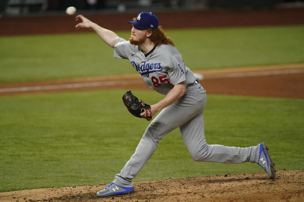 Dodgers pitcher Dustin May throws against the Tampa Bay Rays during the seventh inning of Game 5 of the World Series.