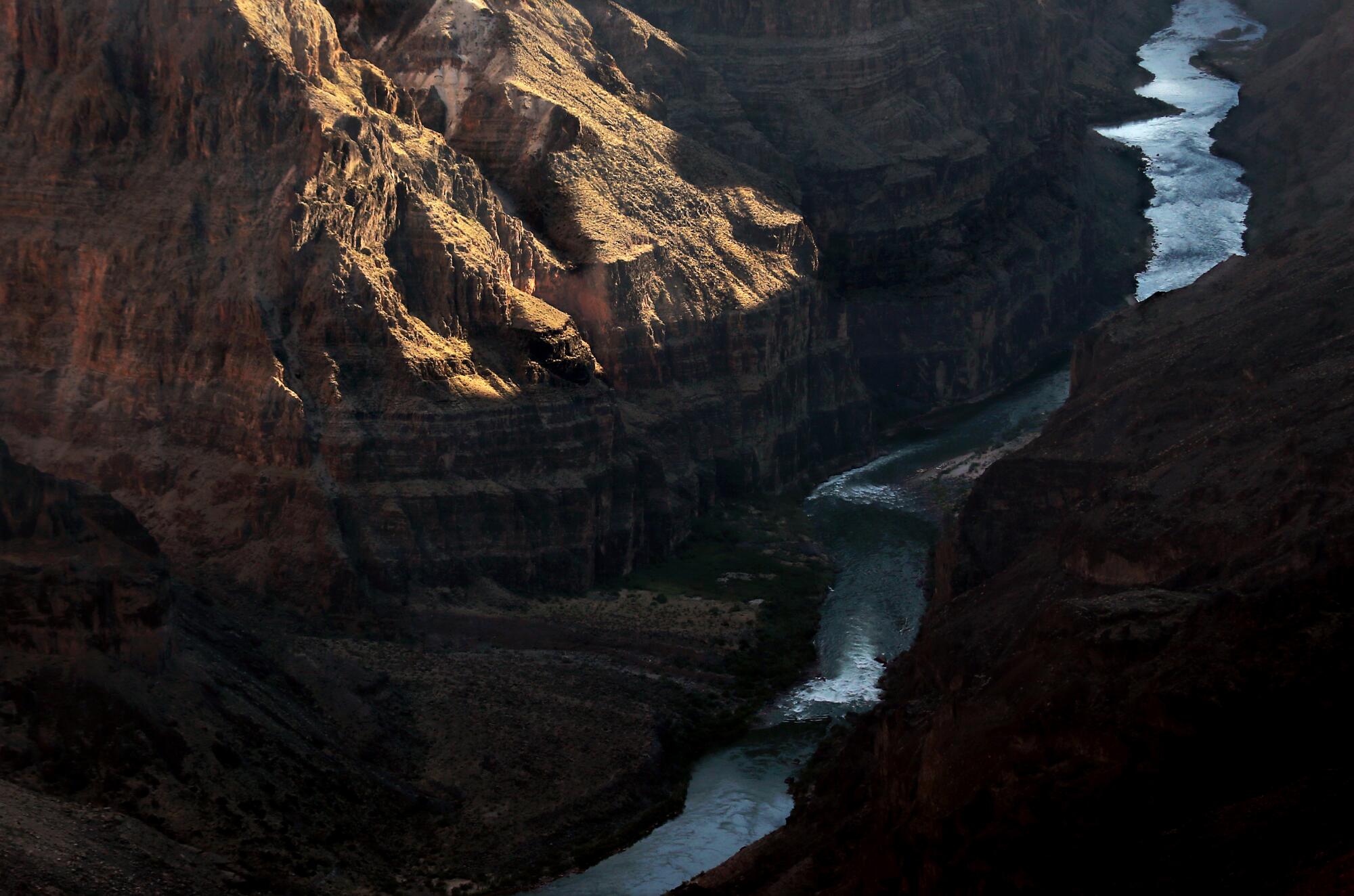 The Colorado Rivers passes between steep canyon walls.