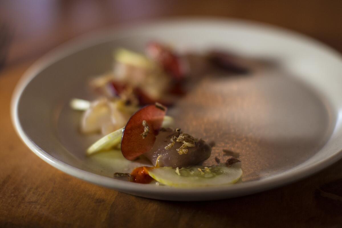 First of a four-course dinner: Red snapper kinilaw with black plum, lemon cucumber and sugar cane vinegar.