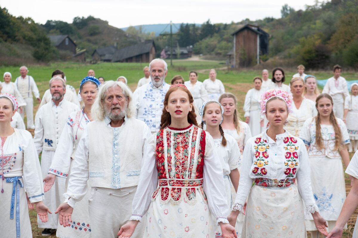 Isabelle Grill, center, in a scene from "Midsommar." 