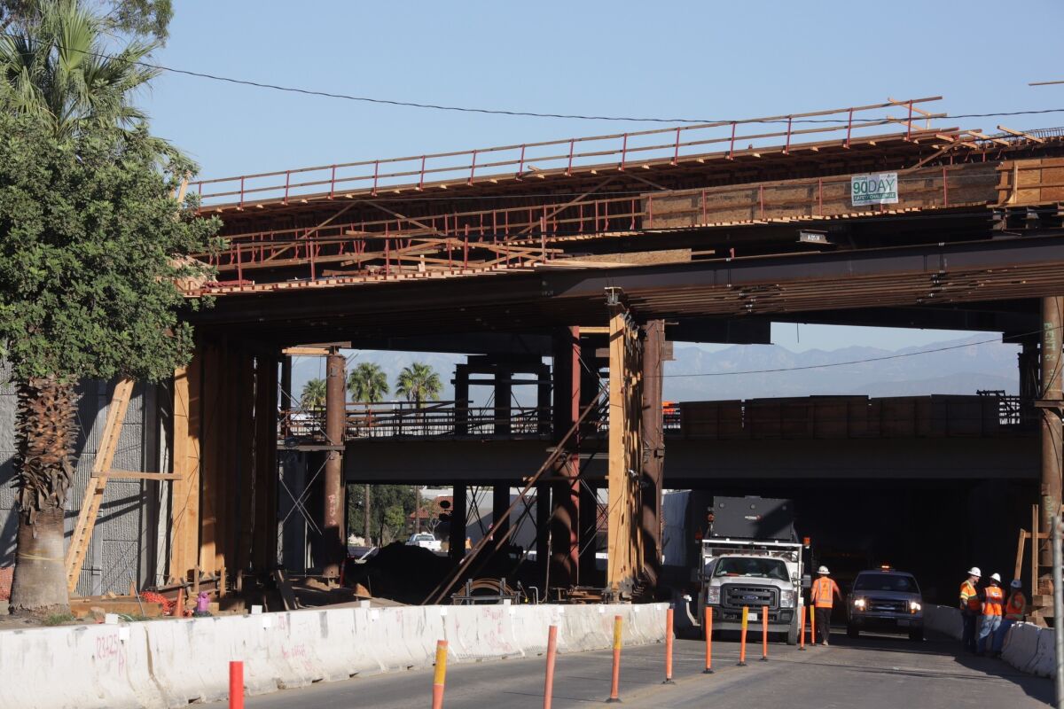 Part of a freeway onramp bridge under construction on the 91 Freeway in Corona that collapsed late Friday, injuring at least 10 workers.