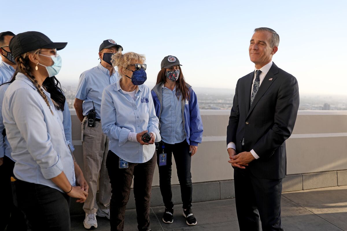 Mayor Eric Garcetti, right, meets with Griffith Observatory staff