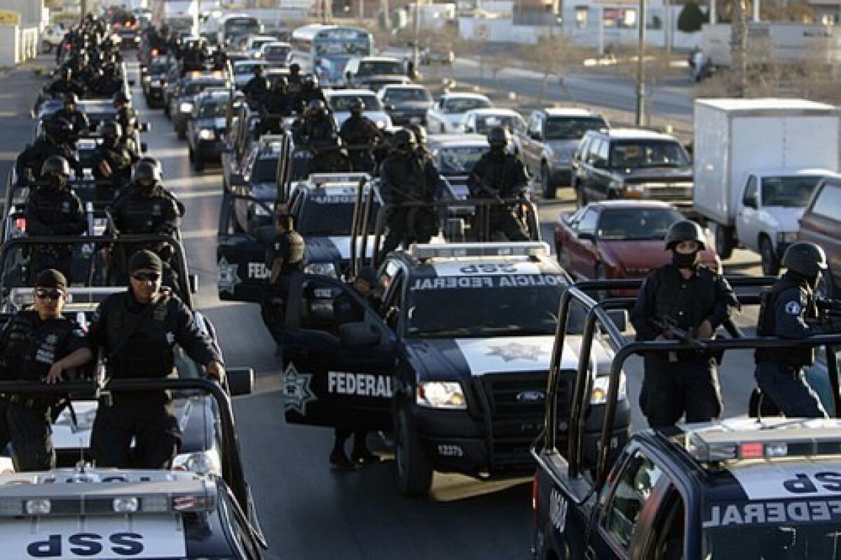 Federal police arrive in Mexicos most violent city, just across the border from El Paso, as part of a security buildup that is also to include thousands of additional soldiers.