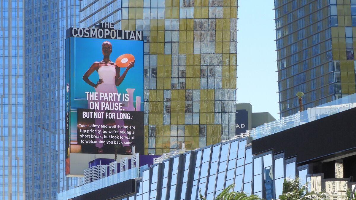 Las Vegas casino-hotels shift gears on the party messaging. "The party is on pause" appears at The Cosmopolitan of Las Vegas.
