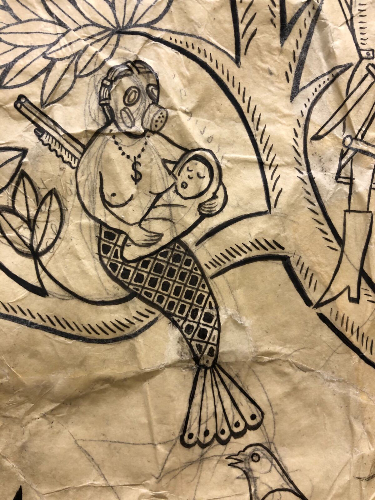 An ink and paper drawing shows a mermaid in a gas mask holding an infant