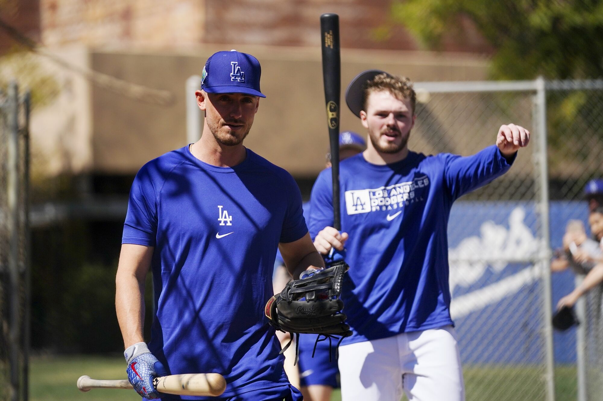 Cody Bellinger, left, and Gavin Lux walk to batting practice March 13.
