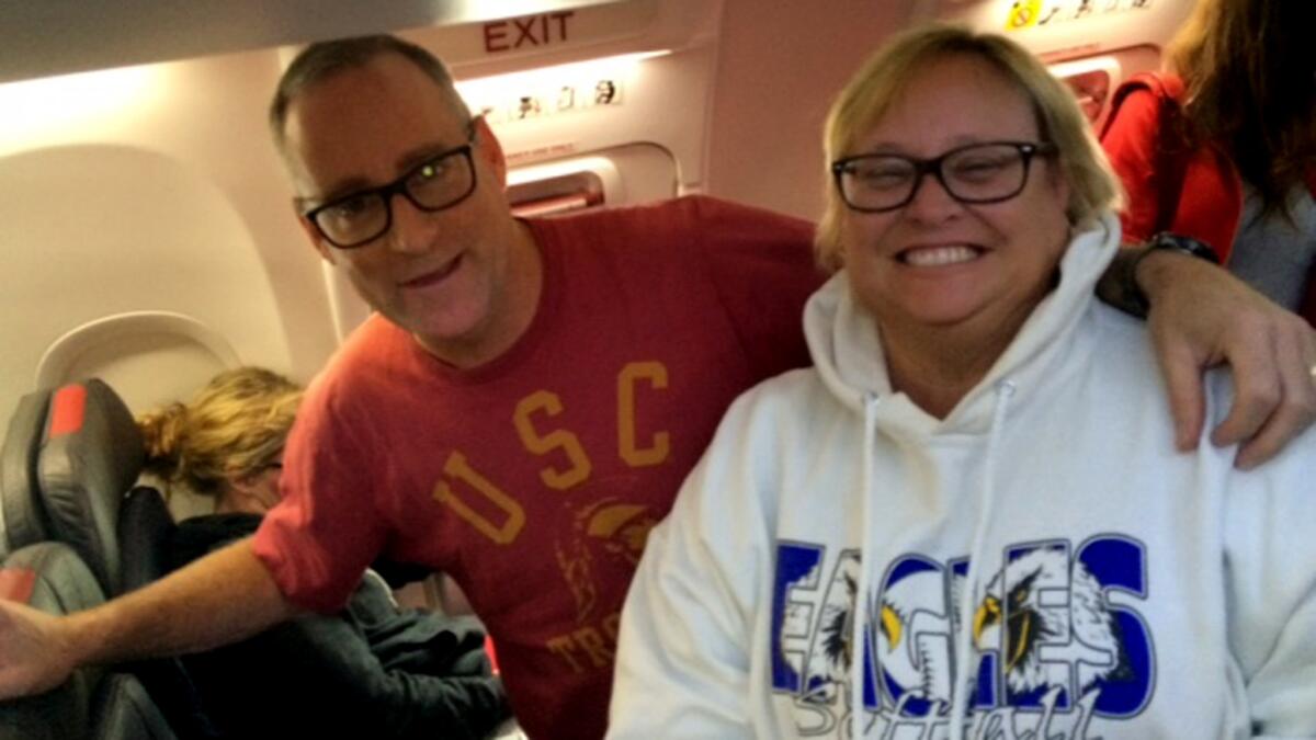Chris and Christine Bergen head to their seats on the flight to Chicago.