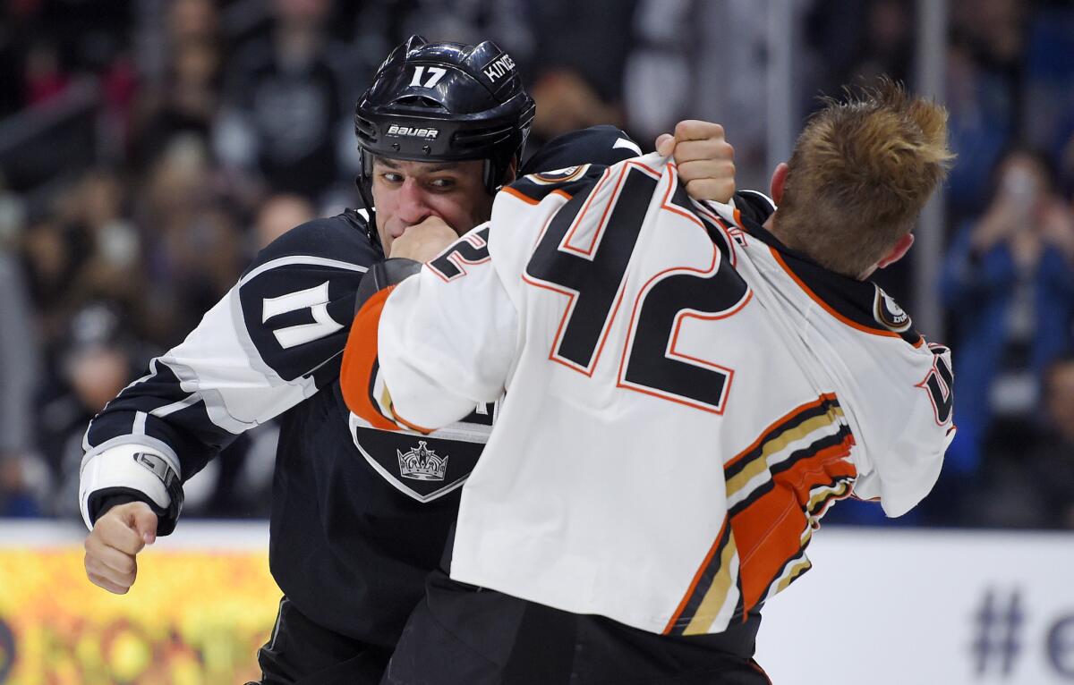 Kings left wing Milan Lucic (17) fights with Ducks defenseman Josh Manson (42) during the second period of a preseason game Sept. 29, 2015.