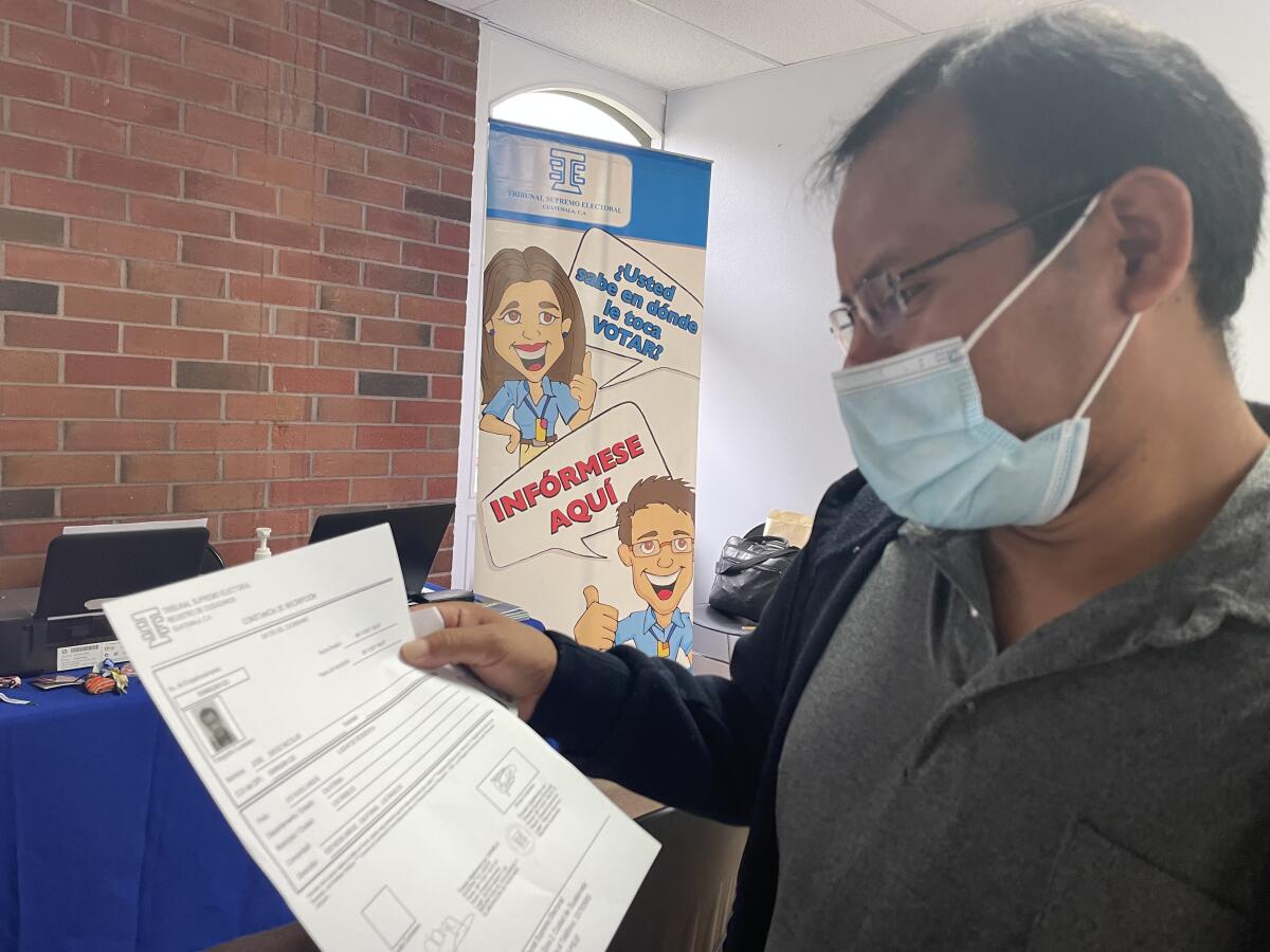 A man looks at a document in his hand