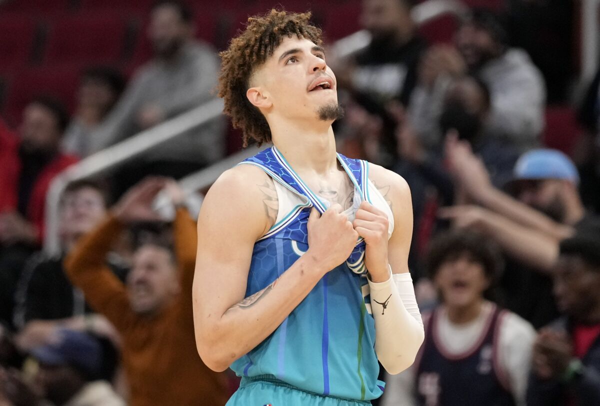 Charlotte Hornets guard LaMelo Ball reacts after committing a foul during the second half of an NBA basketball game against the Houston Rockets, Saturday, Nov. 27, 2021, in Houston. (AP Photo/Eric Christian Smith)