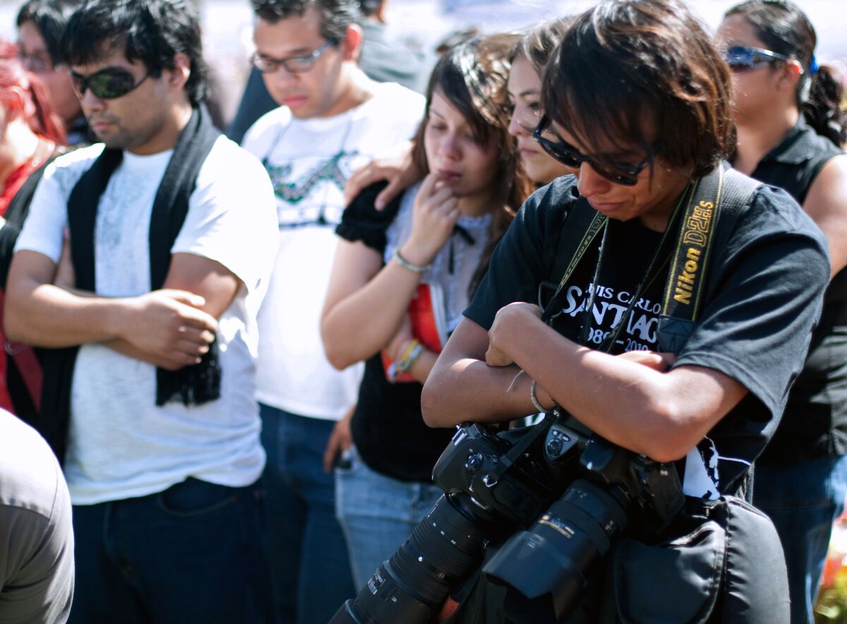 Relatives and friends of murdered 21-year-old photojournalist Luis Carlos Santiago